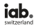 Logo mit den schwarzen Kleinbuchstaben "iab." und einem grauen Punkt, darüber das Wort "switzerland" in schwarzen Kleinbuchstaben auf hellem Grund.