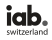 Logo mit den schwarzen Kleinbuchstaben "iab." und einem grauen Punkt, darüber das Wort "switzerland" in schwarzen Kleinbuchstaben auf hellem Grund.